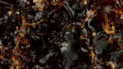 Splashing cola or ice tea, top view