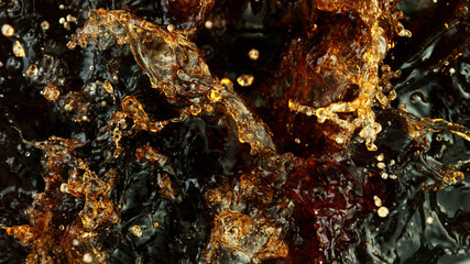 Splashing cola or ice tea, top view