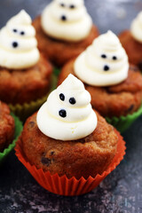 halloween cupcake and pumpkin on a dark background. sweets with cupcakes for the celebration of spooky Halloween.