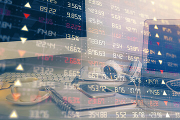 Financial chart drawing and table with computer on background. Double exposure. Concept of...