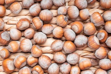 Nuts on natural wooden background, top view.