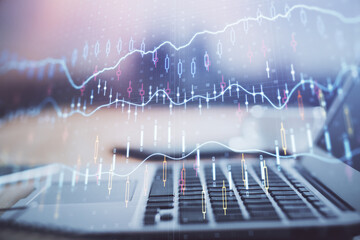 Financial market graph hologram and personal computer on background. Double exposure. Concept of forex.