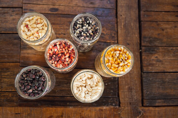 Different species and colors of corn on wooden table. Corn for tortillas on wooden table. Mexican food.