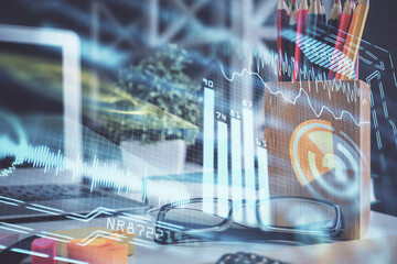 Tech theme hologram with glasses on the table background. Technology concept. Double exposure.