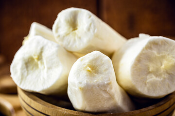 cassava, a root used in Brazilian cuisine, called macaxeira, cassava, castelinha, uaipi, sweet cassava, maniva, maniveira and poor bread. root inside wooden pots
