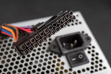 Large plug to power the PC motherboard. Components of the computer power supply.