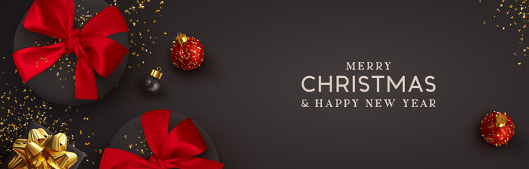 Christmas banner. Background Xmas design of realistic black gift box red bow, 3d render bauble ball and glitter gold confetti. Horizontal christmas poster, greeting card, headers for website
