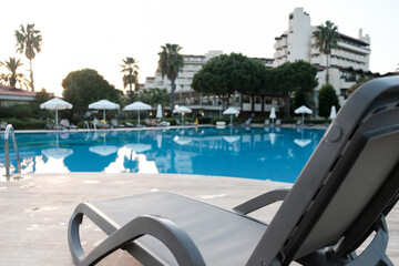 Luxury swimming pool at beautiful hotel. Tropical vacation or weekend getaway for couple. All...