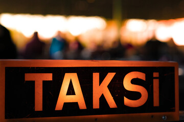 Taxi sign on the roof of a taxi at night, Istanbul, Turkey.