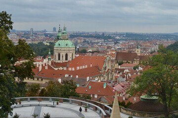 Fototapeta premium Prague skyline with its orange tiled roofs and many spires
