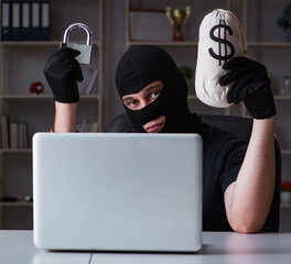 Hacker hacking computer late at night