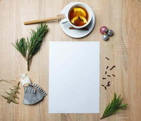 Winter holiday still life. Blank copy space mockup of an winter composition with pine branch. Christmas concept. Styled stock flat lay photo. Top view, vertical.