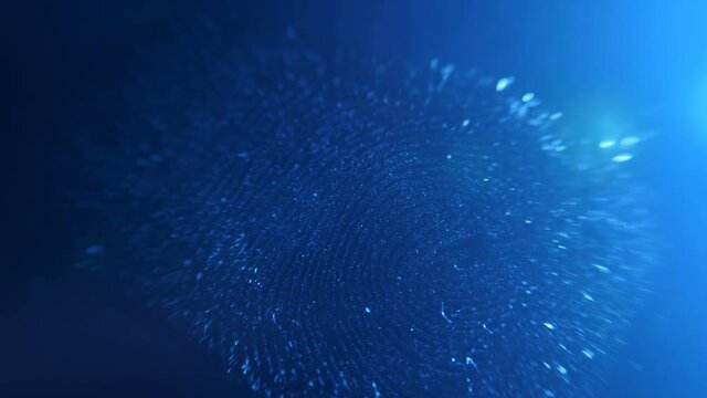 In the dark with blue illumination on a smooth surface, a distinct fingerprint of the alleged killer was found. Crime scene investigation. Shooting allows you to see the smallest details of the print 