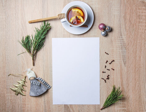 Winter holiday still life. Blank copy space mockup of an winter composition with pine branch. Christmas concept. Styled stock flat lay photo. Top view, vertical.