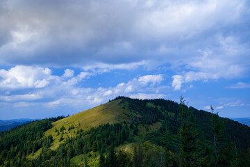 Obraz premium summer mountain landscape highland forest scenic view nature photography in slightly cloudy June day