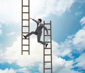 Businessman climbing career ladder in business concept