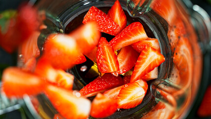 Berries fresh smoothie blended in blender, top view. Healthy eating concept.