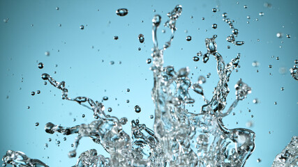 Water splash isolated on blue background, freeze motion