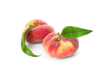 Fresh ripe donut peaches with leaves on white background