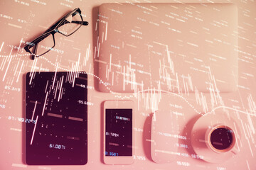 Multi exposure of financial chart hologram over desktop with phone. Top view. Mobile trade platform...