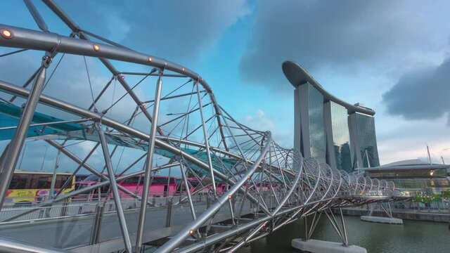 Singapore City - Singapore - FEB 2020: Time lapse The Helix Bridge at night, helix bridge walking tourist marina bay sands in FEB 2020, Singapore.