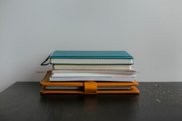 Stack of notebooks on desk