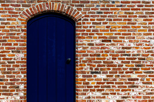 Blue door in a brick wall