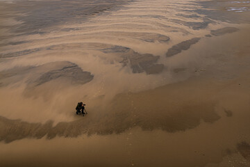Fototapeta na wymiar photographing on the beach and sand