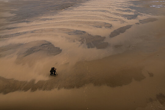 photographing on the beach and sand