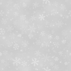 Christmas seamless pattern of snowflakes of different shapes, sizes and transparency, on gray background