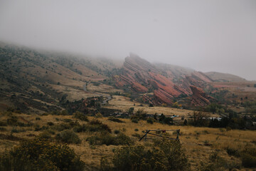 Fototapeta na wymiar Red Rocks Amphitheater in the distance on a foggy day
