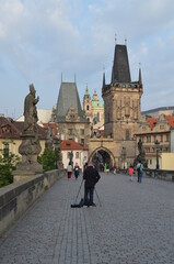Obraz premium Prague person walking on charles bridge