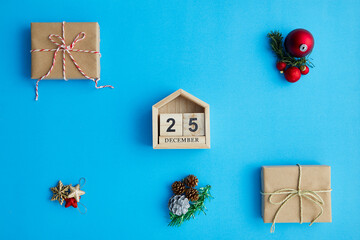 Christmas calendar and Christmas decorations on a blue surface