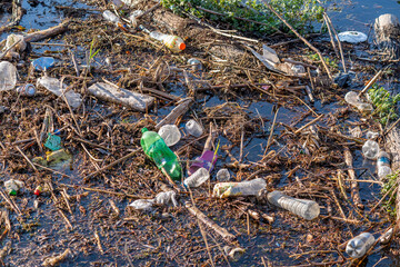 Environmental problem. Plastic waste in the river, pollution and the environment in the water.