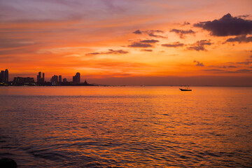 Naklejka na ściany i meble Sunset and silhouette of sea