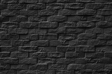 Black stone brick wall texture.