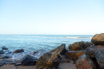 Waves on the seaside rocks are splashing on the rocks natural background