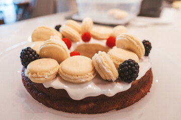 cheesecake with berries and macarons