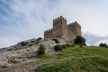 Obraz premium Bottom view of the tower of Genoese fortress of the 14th century in the Sudak bay on the Peninsula of Crimea
