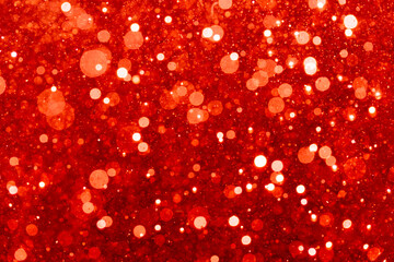 Red bokeh of light textured glitter background
