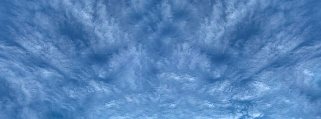 Blue sky with clouds in the daytime.