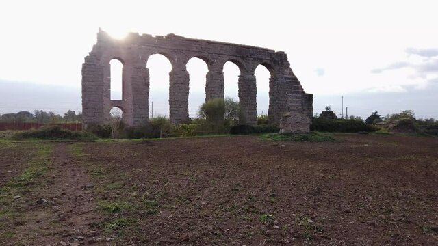Detail of an aqueduct from ancient Rome in parco degli acquedotti in the outskirts of the capital of Italy, Dolly forward movement