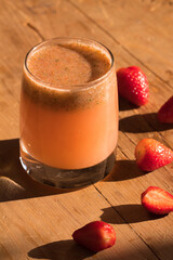 glass of strawberry cured pulque