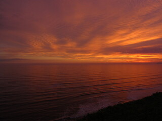 Fototapeta na wymiar Sea reflecting the sunset in front of the Miraflores boardwalk