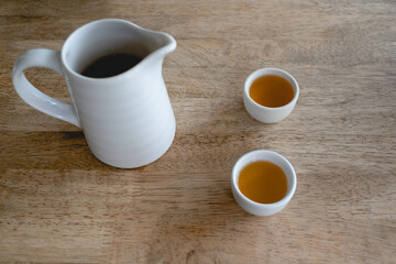 Set of simple white Chinese tea on a wooden table.