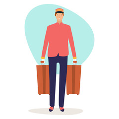 A happy bellboy is carrying two suitcases from a hotel guest