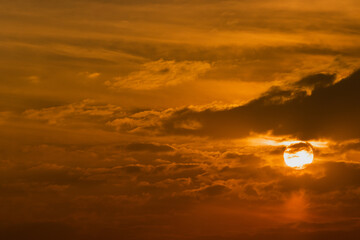 The sun, the sky sunset sun and clouds, bright twilight background. Everything lies above the surface of the atmosphere.
