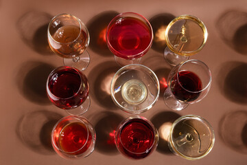 colored cocktails with shadows on a brown background