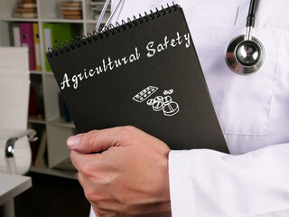 Medical concept about Agricultural Safety  with phrase on the sheet.