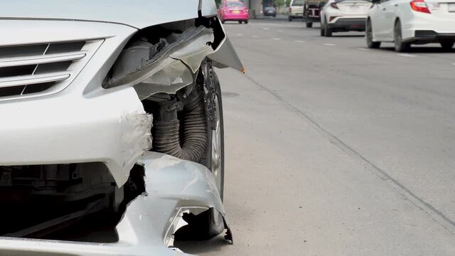 Front of car crash get damaged by accident on the road in the city, damaged automobiles